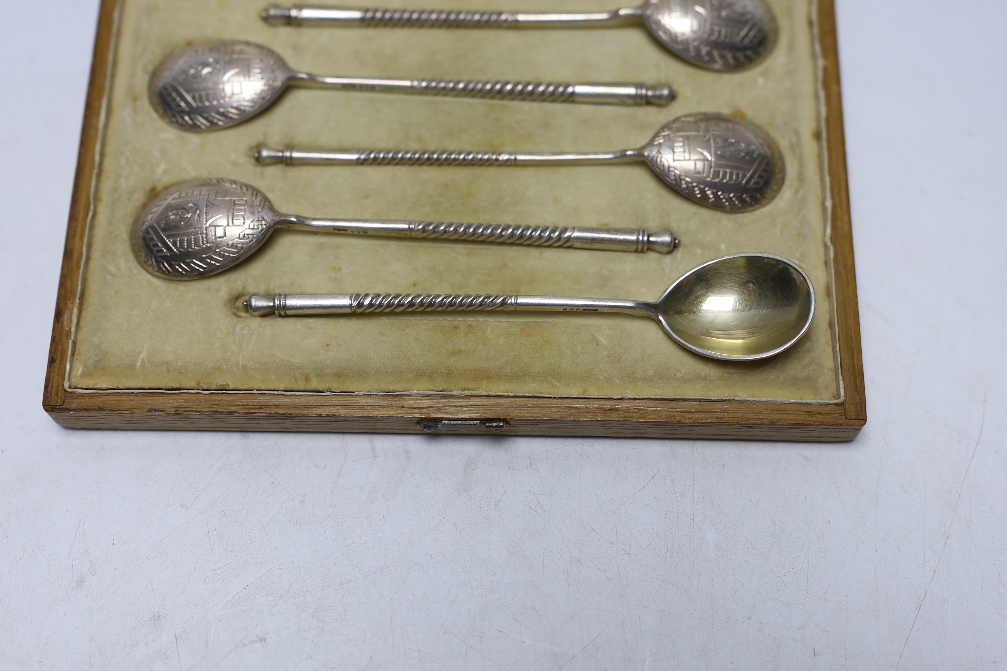 A cased set of six late 19th/early 20th century Russian 84 zolotnik teaspoons with engraved bowls, master, Matryena Andreyevna? 12.8cm.